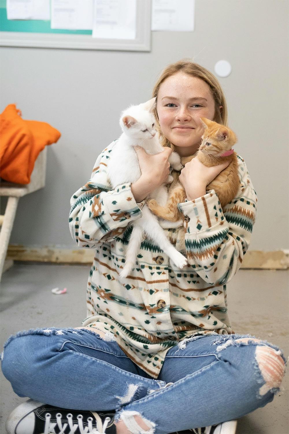 Volunteer holding cat